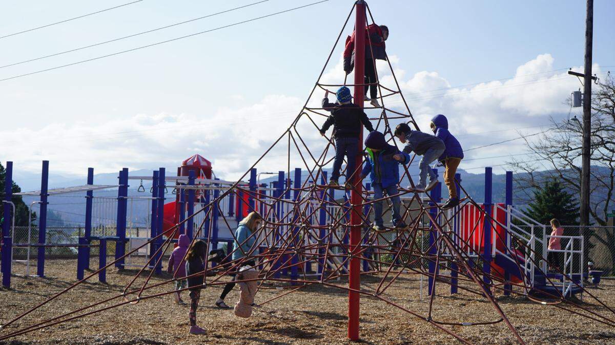 Children play at the Silver Beach Elementary School playground Friday, April 14, in Bellingham. The playground is expected to be replaced with an inclusive playground by the 2023-2024 school year.