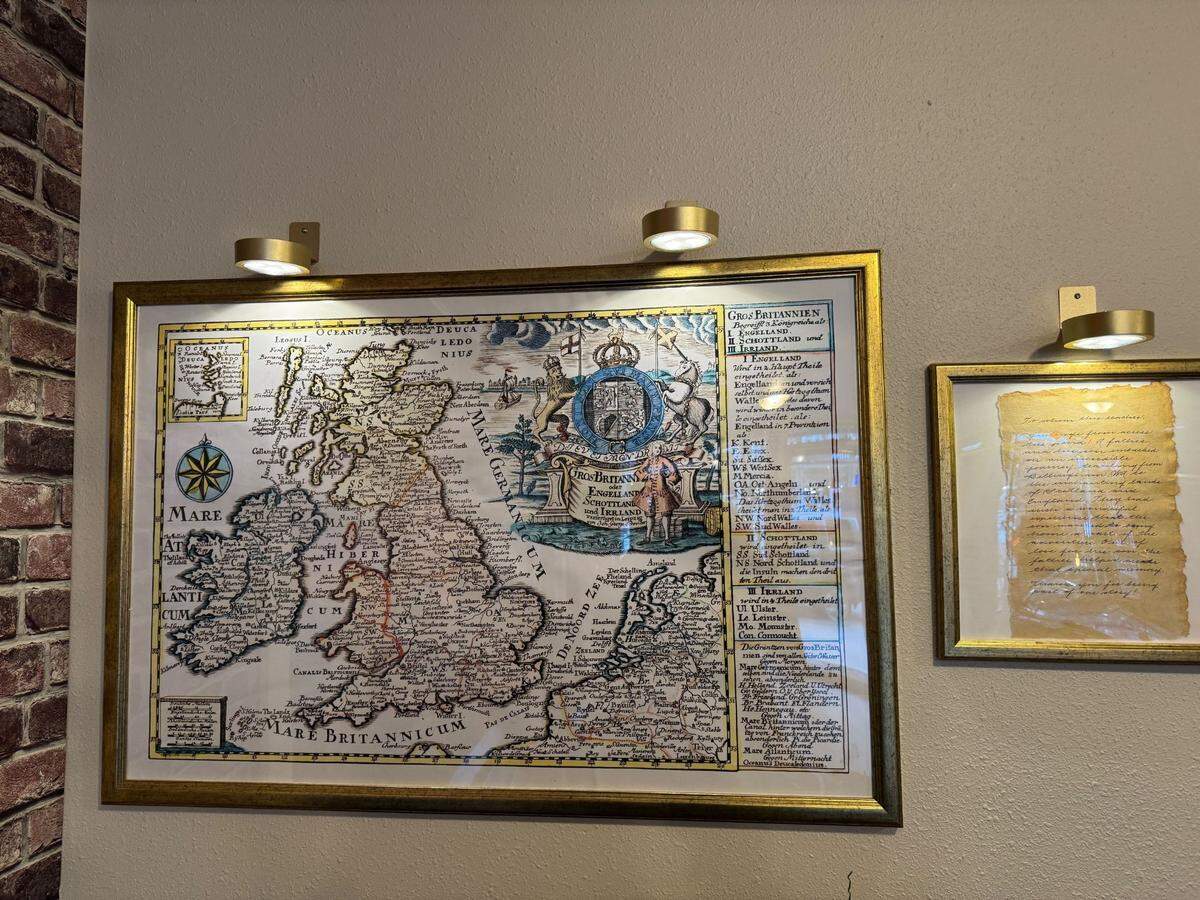 A map and framed mission statement of the restaurant’s origin story hang on the wall.