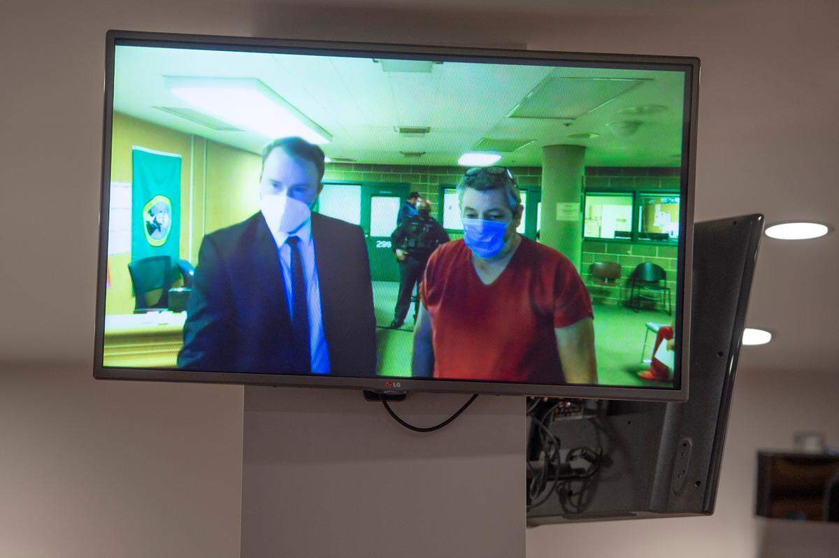 Joel Berck Young of Maple Falls appears on closed-circuit television at the Whatcom County Courthouse during his arraignment on Friday, Feb. 18, in Bellingham. He pleaded not guilty to charges stemming from the shooting and injuring of two Whatcom County Sheriff’s deputies last week.