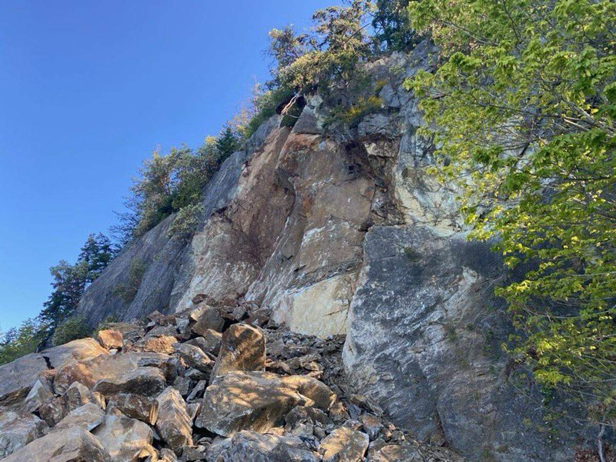The rockslide appears to have collapsed from a nearby cliff, blocking off Chuckanut Drive.