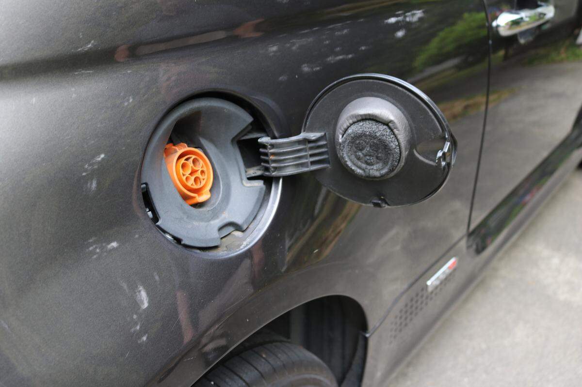 Don Minter of Bellingham has owned an electric vehicle for about a year. The car’s charging port is under the gas cap.