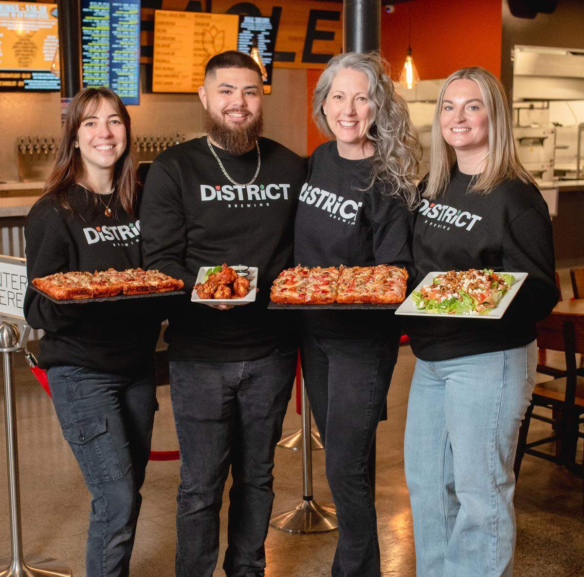District Brewing’s Ferndale team, from left, Marisa High, Ferndale ktchen manager; Gabe Mercado, general manager; Amy Woodward, Ferndale manager; Tara Watts, Lynden manager.