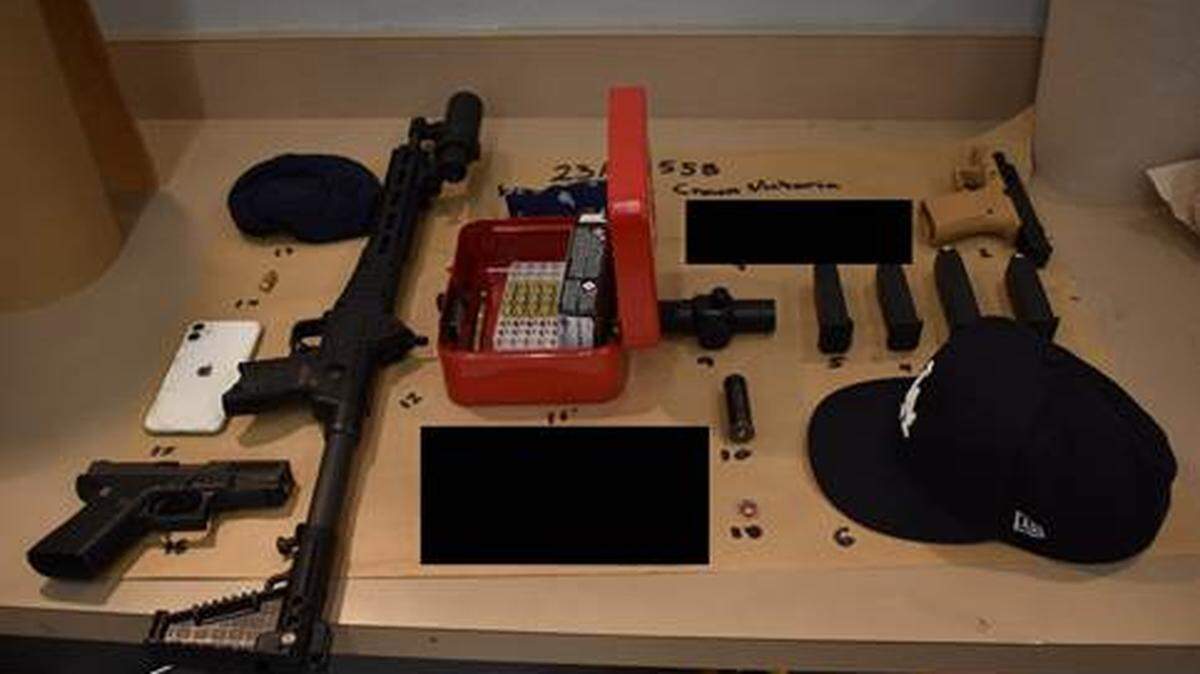 A Whatcom County Sheriff’s Office photo shows the semiautomatic pistols, a rifle, magazine and ammunition that were found in the car of a drive-by shooting suspect on Saturday, June 17, 2023, in Bellingham, Wash.