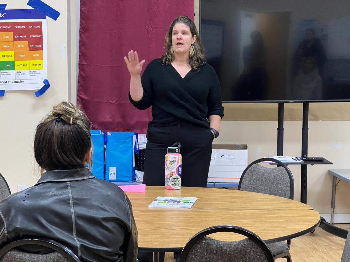 Ann Beck, community health and human services manager for the Whatcom County Department of Health and Community Services, talks to visitors during a tour of the severe weather shelter on Nov. 12.