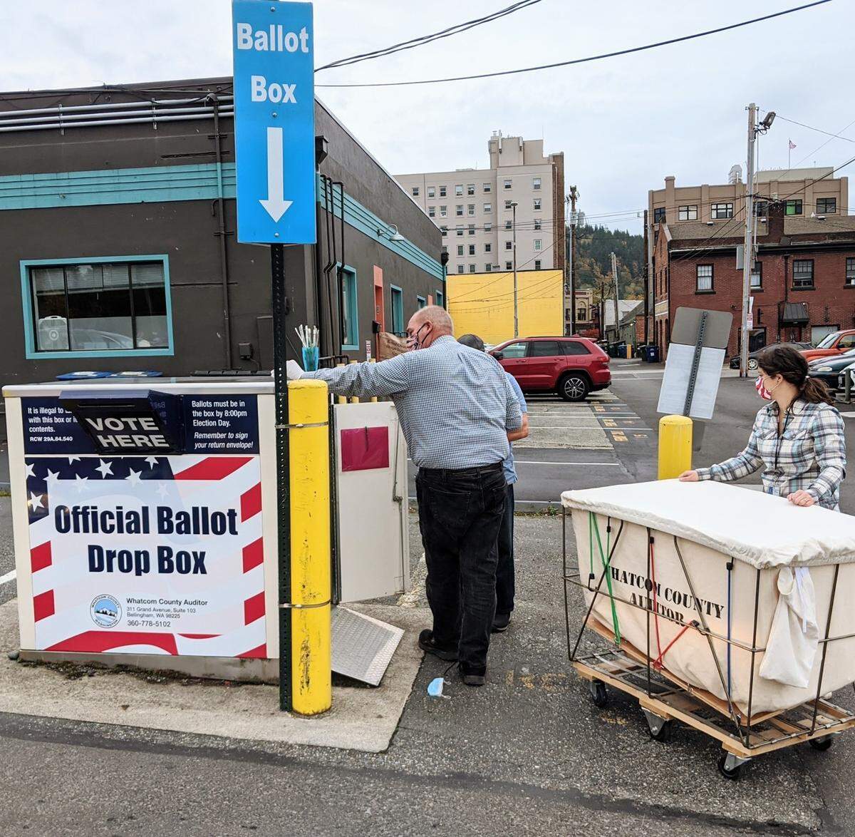 Whatcom County posted to Facebook that there was a continual flow of cars at the election ballot dropbox near the County Courthouse on Monday, Oct. 19, 2020, in Bellingham, Wash.
