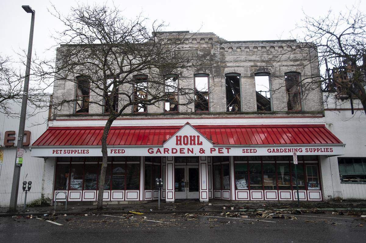 Fire destroyed the Hohl Feed & Seed building in downtown Bellingham Feb. 18. Paul Jonathon Wolfe, 56, was sentenced to a month in jail Monday for reckless burning.
