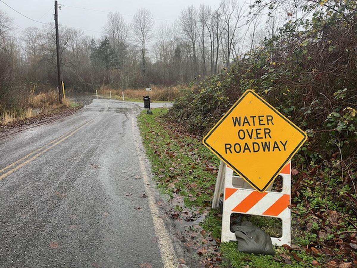 Water was flowing over Bayon Road near Marietta-Alderwood on Wednesday, Dec. 10, 2025, as the county prepared for flooding following several days of heavy rain.