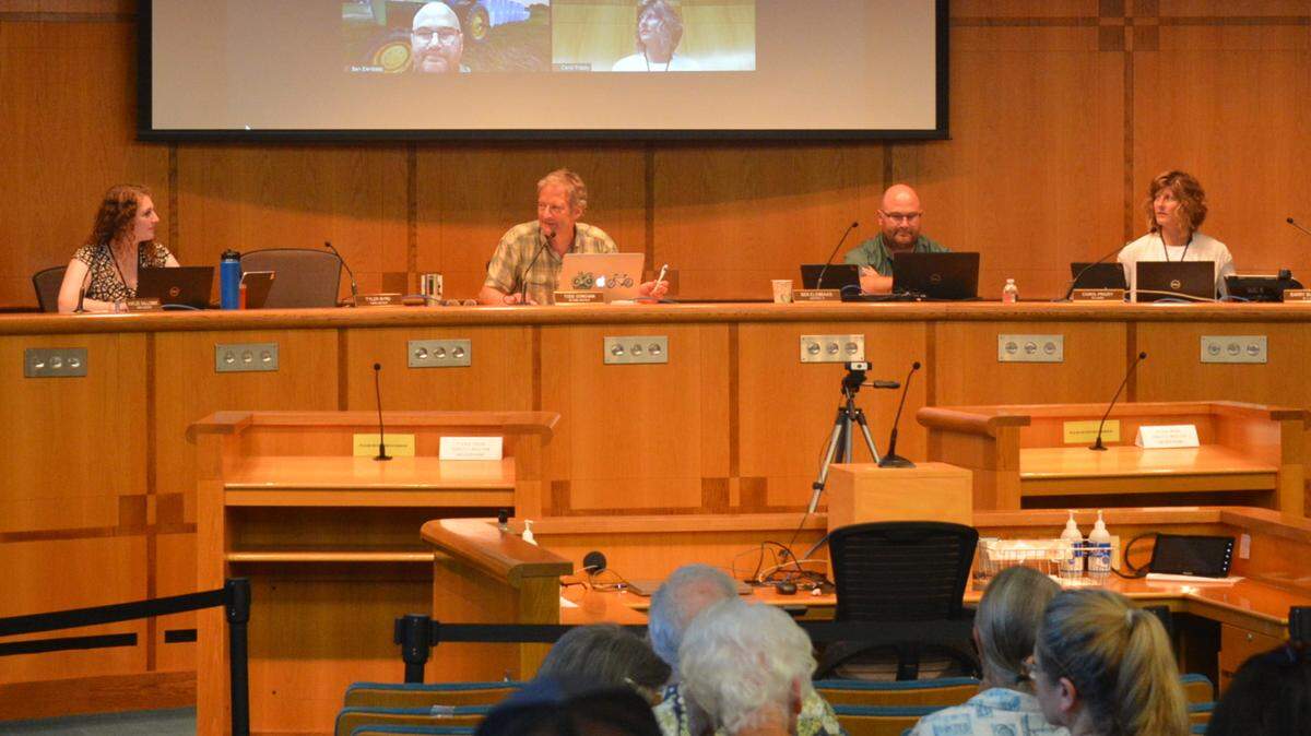 Whatcom County Council members sit on the council dias in chambers at the Whatcom County Courthouse.