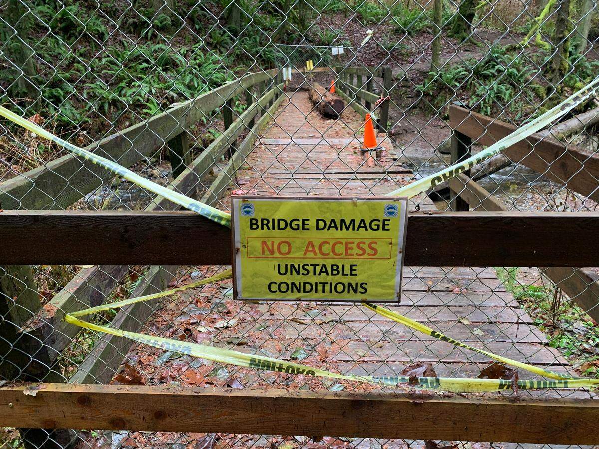 The bridge over Chuckanut Creek on the Interurban Trail in the Fairhaven area of Bellingham remains closed Friday, Dec. 9. The damaged bridge is expected to be repaired in summer 2023.