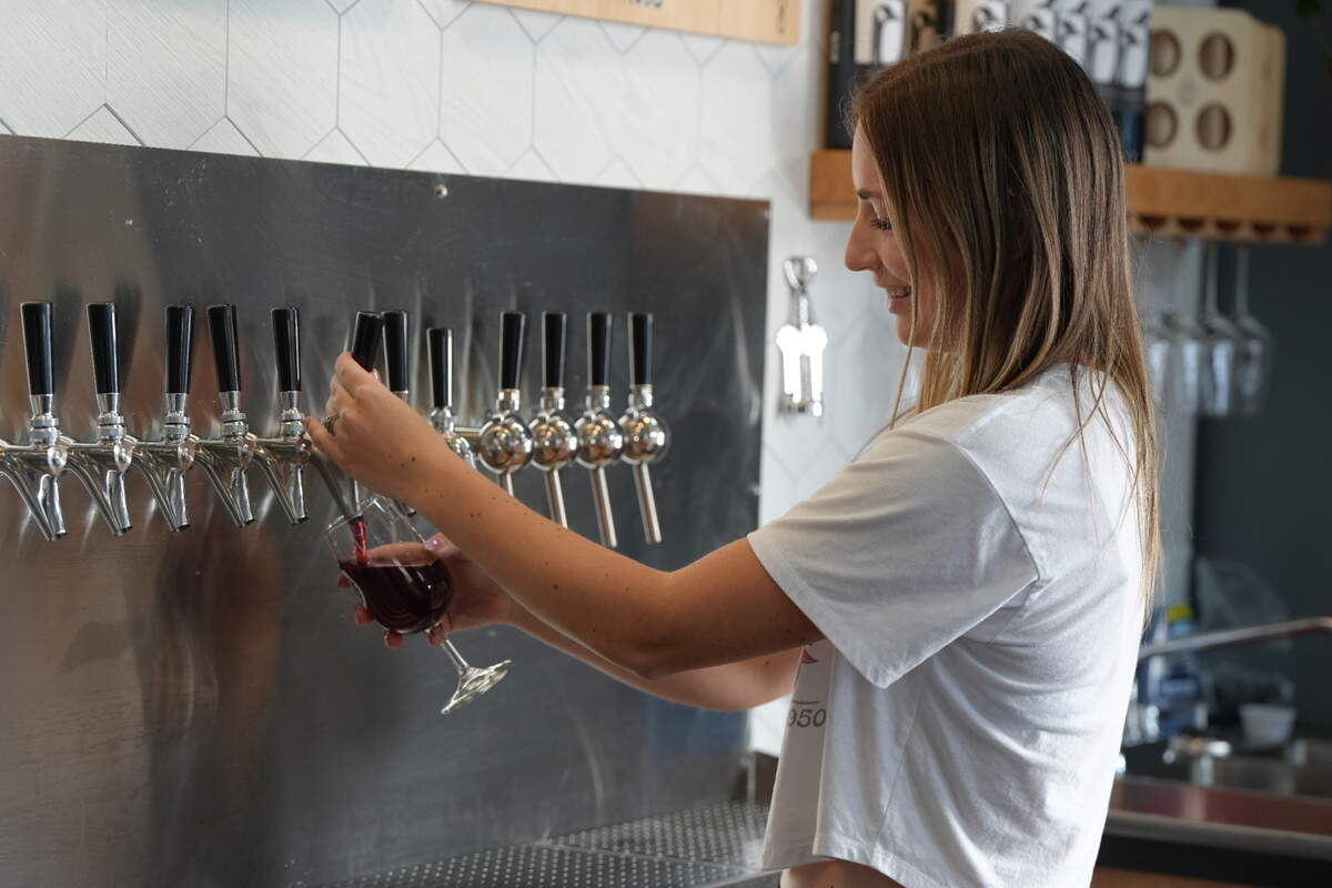 An Overflow Taps employee pours a cider on September 16, 2024, in Lynden, Wash.