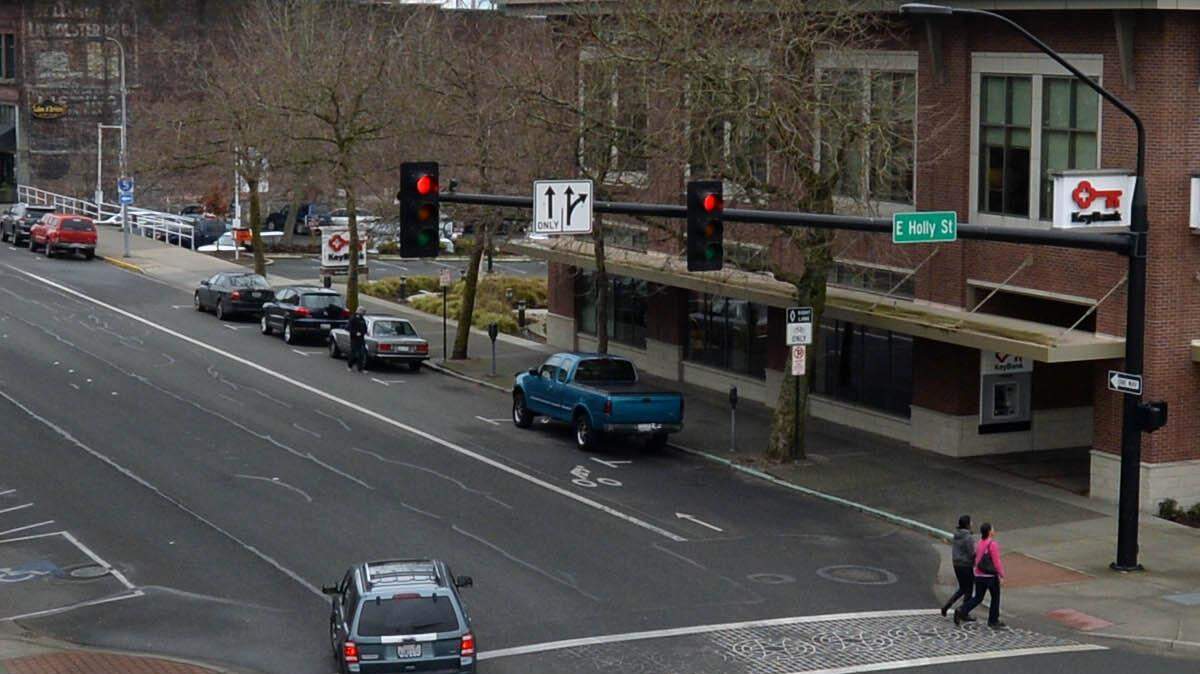 Downtown intersections, like this one at East Holly Street and North State Street in Bellingham,  are often busy for both drivers and pedestrians.