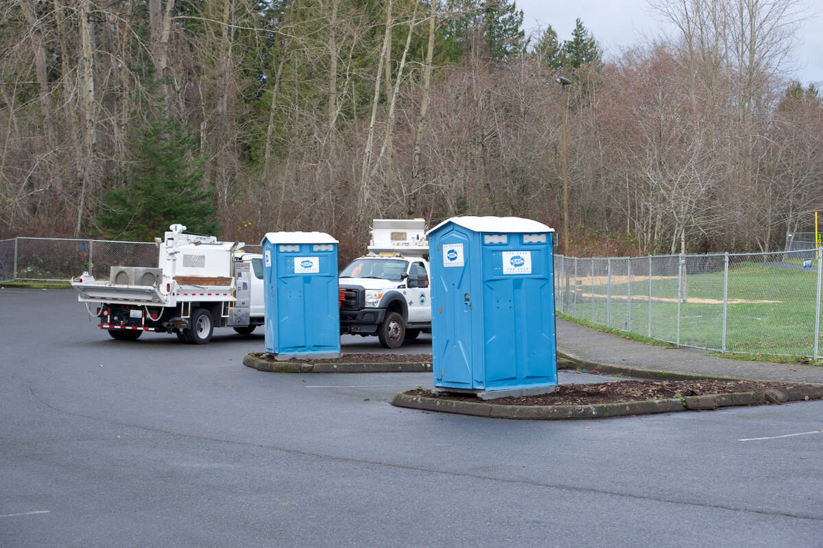 Portable restrooms were placed in the parking lot of Geri Fields on Friday, Dec. 11, in Bellingham. Geri Fields will serve as a new temporary encampment for people without housing this winter.