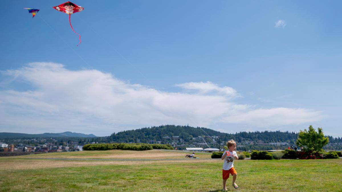 Owen Huckstep, 3, flies his kite in the sunshine at Zuanich Point Park on Wednesday, July 28, in Bellingham. A high temperature of 87 degrees is forecast for Bellingham on Friday, July 30, but the Mount Baker foothills and areas near the Canadian border will be much warmer, according to the National Weather Service in Seattle.