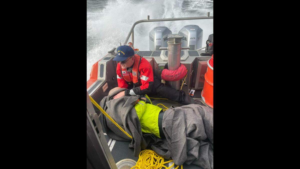 U.S. Coast Guard crew from Bellingham aid a 60-year-old kayaker Saturday, Dec. 10, who overturned in Bellingham Bay.