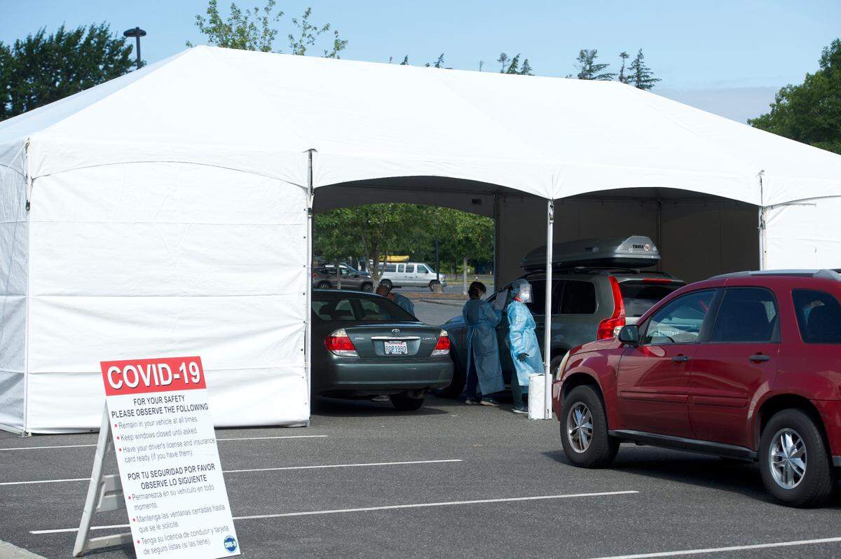 People in cars line up for COVID-19 testing Friday, July 10, at Civic Athletic Complex in Bellingham, Wash., where the Whatcom County Health Department held drive-thru testing July 10-11 and July 17-18.