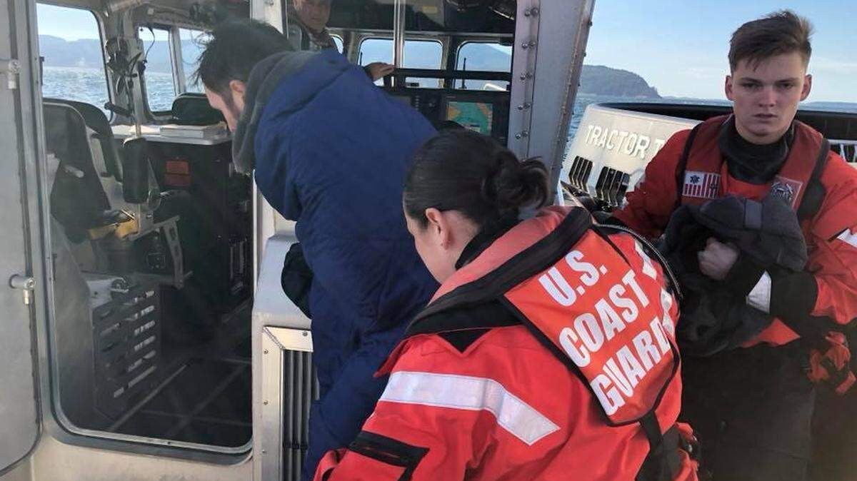 A crew from the U.S. Coast Guard Station Bellingham, along with help from a tugboat in the area, rescued two kayakers who had their crafts capsize and sink Tuesday near Sinclair Island, southwest of Lummi Island.