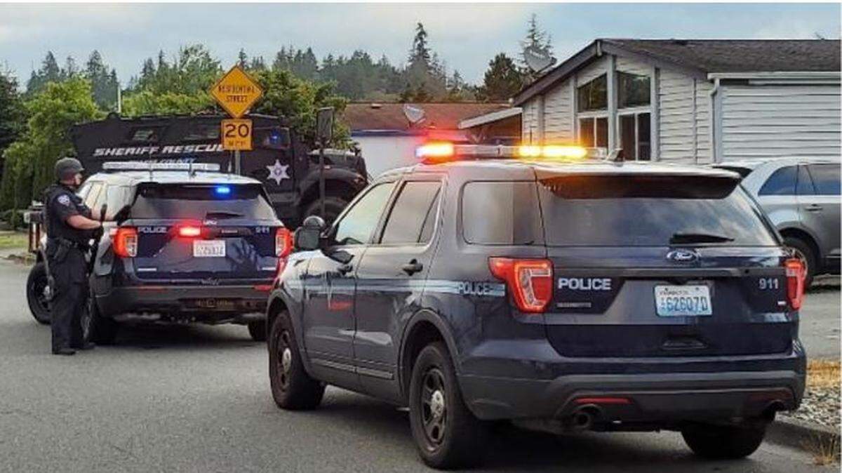 Members of the Mount Vernon Police, assisted by the Skagit County Sheriff’s Office, Washington State Patrol and Sedro Woolley and Burlington police departments, serve warrants at two locations in Mount Vernon Friday, July 22, in connection with the Sunday, July 17, shooting at Walmart that injured five people.