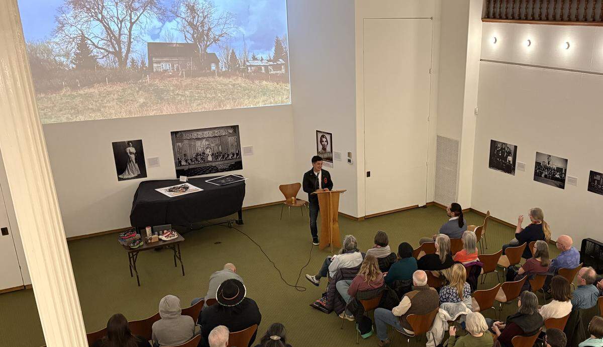 Nooksack artist Louie Gong addresses a crowd at the Whatcom Museum on March 26, 2026.