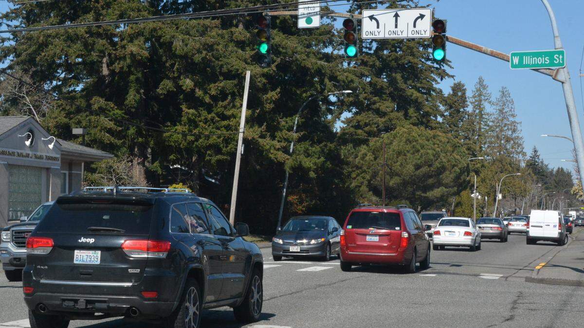 Cars head north on Meridian Street past the West Illinois Street intersection on Thursday, March 23, in Bellingham. The city of Bellingham plans to build a roundabout at the intersection in the summer.