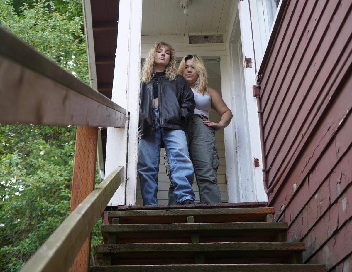 True Ward, left, and Hanuri Kim stand at the top of the stairs in a property they rented at 809 High Street on Wednesday, Sept. 27, 2023. The unit was not cleaned when Ward and Kim moved in. The tenants also had several habitability concerns regarding the state of the unit and were able to break their lease.