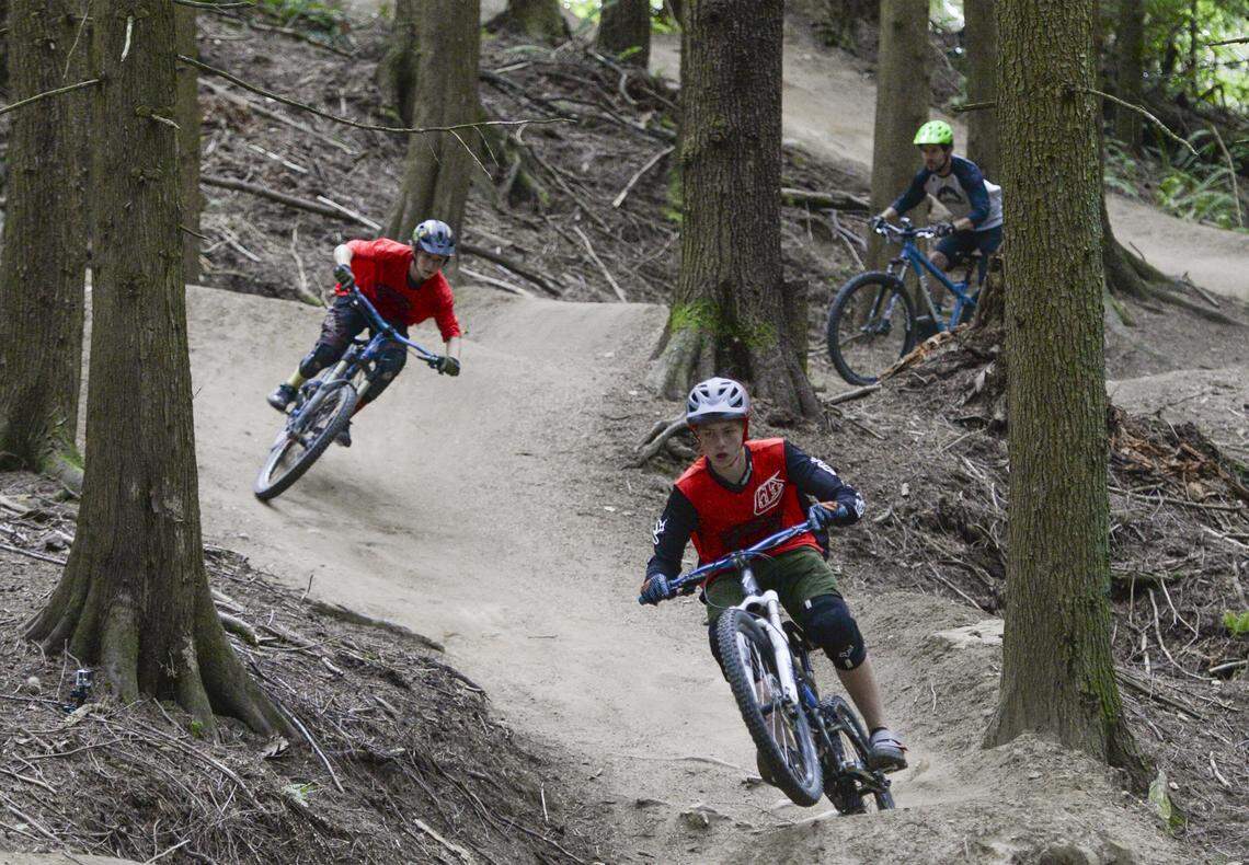 Mountain bikers ride the Evolution Trail on Galbraith Mountain in 2016 in Bellingham.
