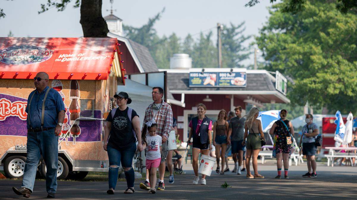 People attend the Northwest Washington Fair on Thursday, Aug. 12, 2021, in Lynden, Wash.