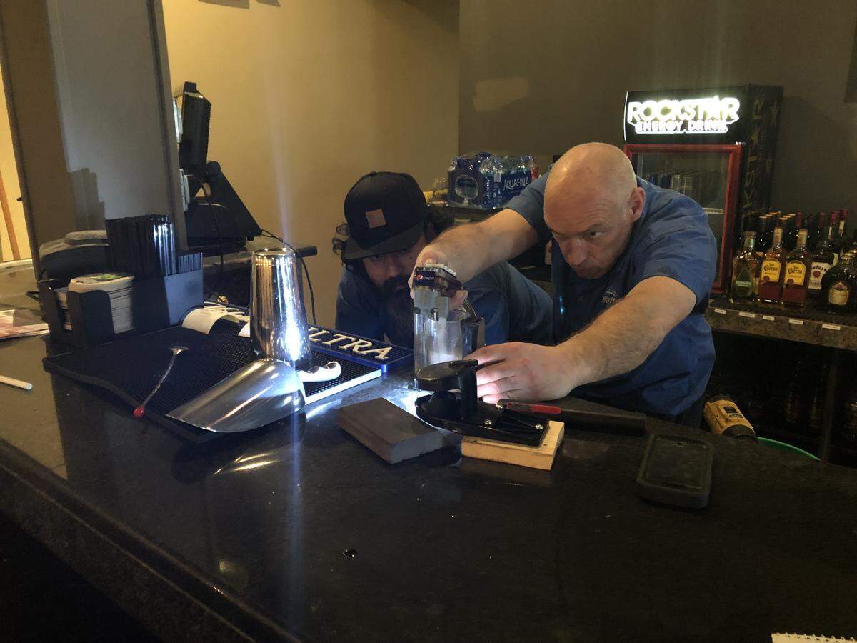 David Ugalde, left, and Steve Drake of Walton Beverage test the taps to make sure the soft drinks have the proper ingredient mix at Frank-n-Stein Pub at 902 N. State St. The pub is expected to officially open on Feb. 1.