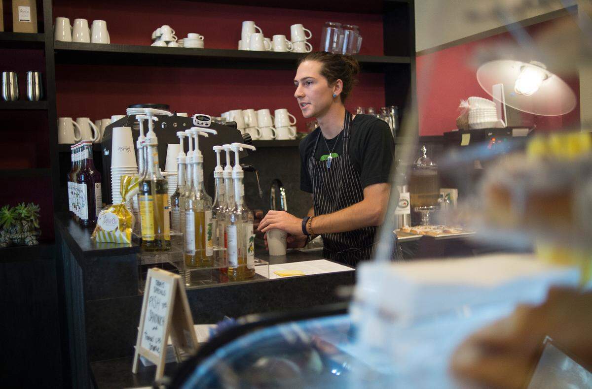 Oliver Venablerose makes an espresso drink for a customer at The Wild Oat Bakery and Cafe on Friday in Bellingham.
