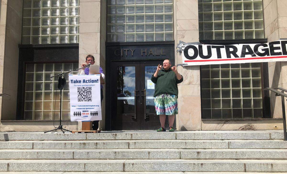 Paul Kramer, an activist and father of a shooting survivor, offers a land acknowledgment for the Lummi and Nooksack people at a rally for gun control on Saturday, June 11, outside City Hall in Bellingham.