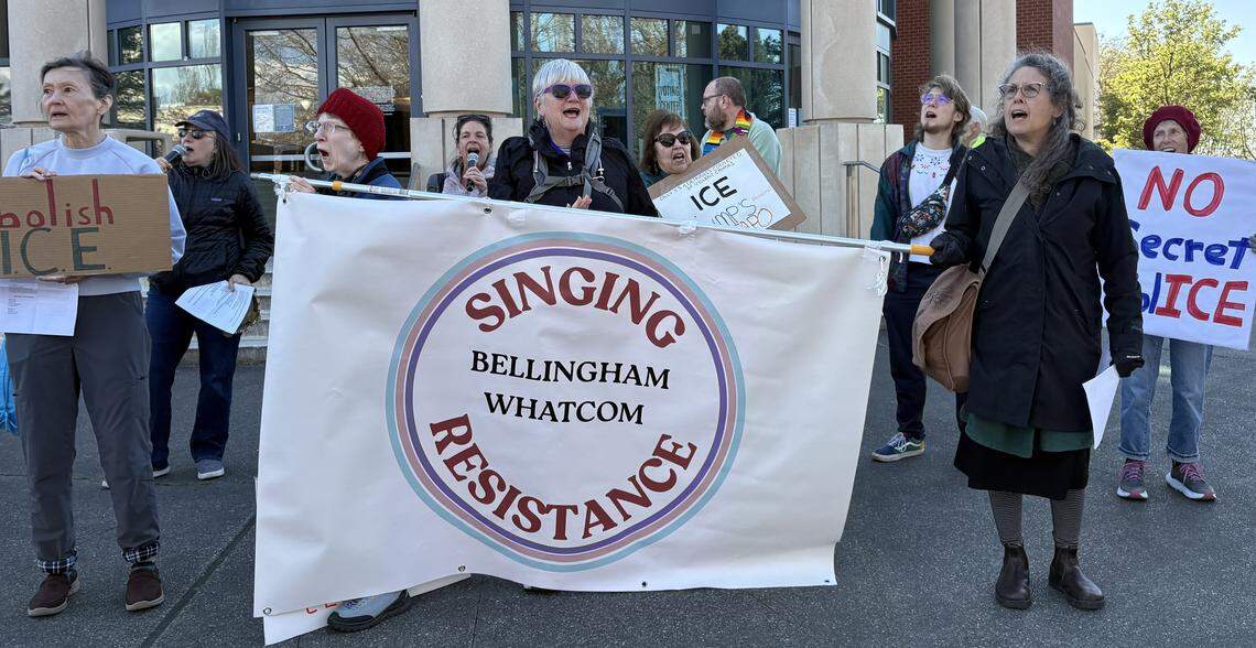 Singing Resistance Whatcom gathered outside the Whatcom County Courthouse in Bellingham to protest federal immigration enforcement in the area on April 16, 2026.