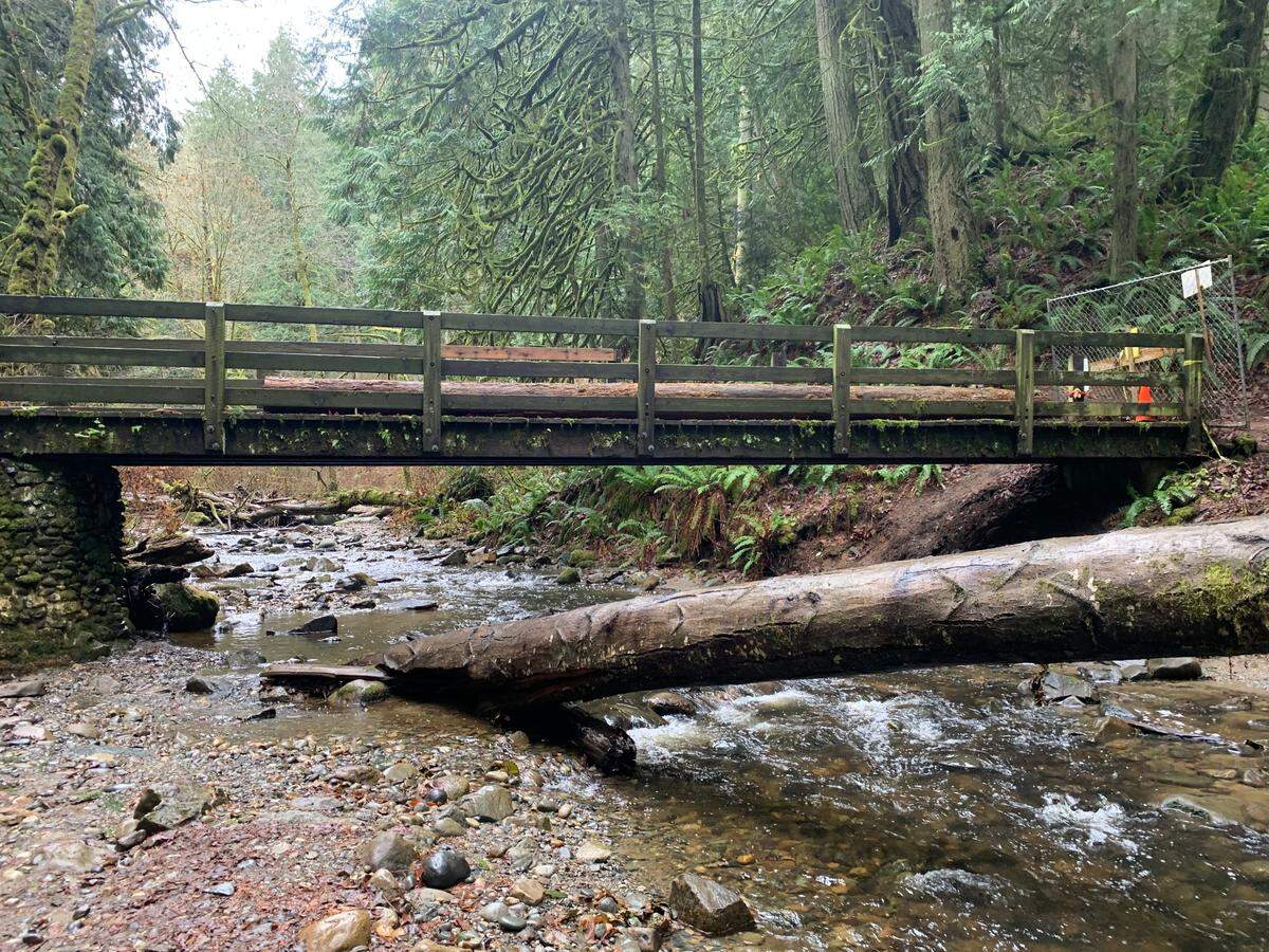 The bridge over Chuckanut Creek on the Interurban Trail in the Fairhaven area of Bellingham remains closed Friday, Dec. 9. The damaged bridge is expected to be repaired in summer 2023.