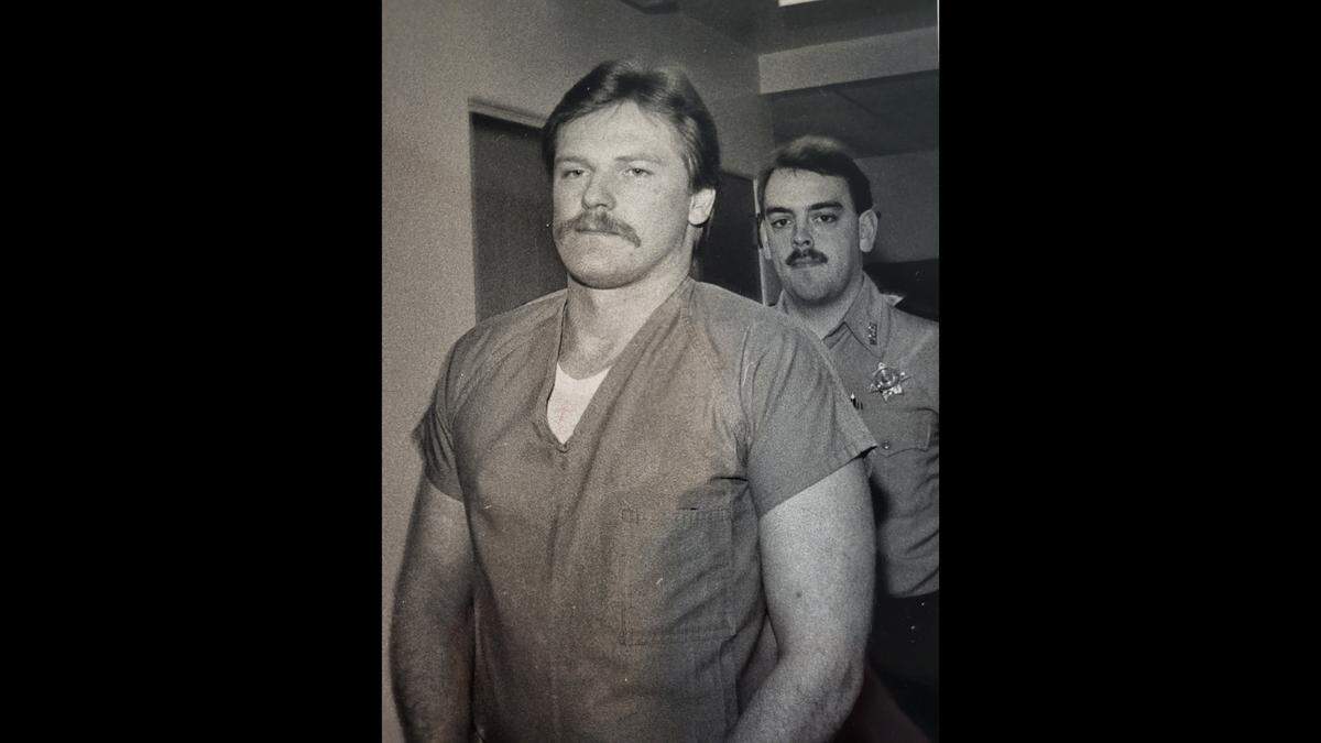 Darren Dee O’Neall is escorted to his first appearance hearing Jan. 11, 1989, in Whatcom County Superior Court where he is accused of stealing the car of 29-year-old Wendy L. Aughe of Bellingham. O’Neall was charged Thursday, March 2, with one count of second-degree murder for Aughe’s death and he pleaded not guilty Friday, March 10, in Whatcom County Superior Court.