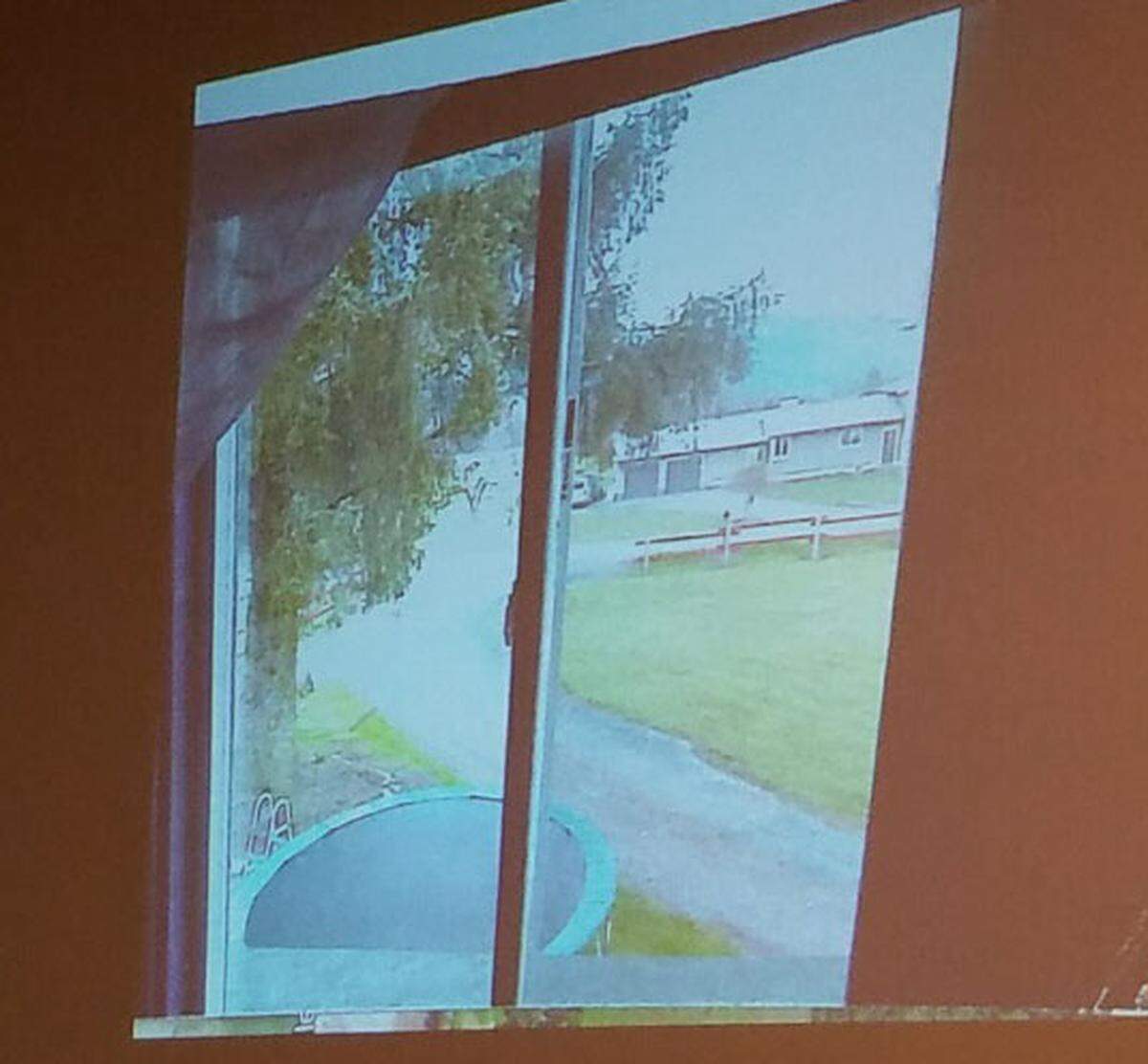 The prosecution shows a slide displaying the view from the room that used to be Timothy Bass’ on Strand Road during a first-degree murder trial Friday, May 17, in Whatcom County Superior Court.