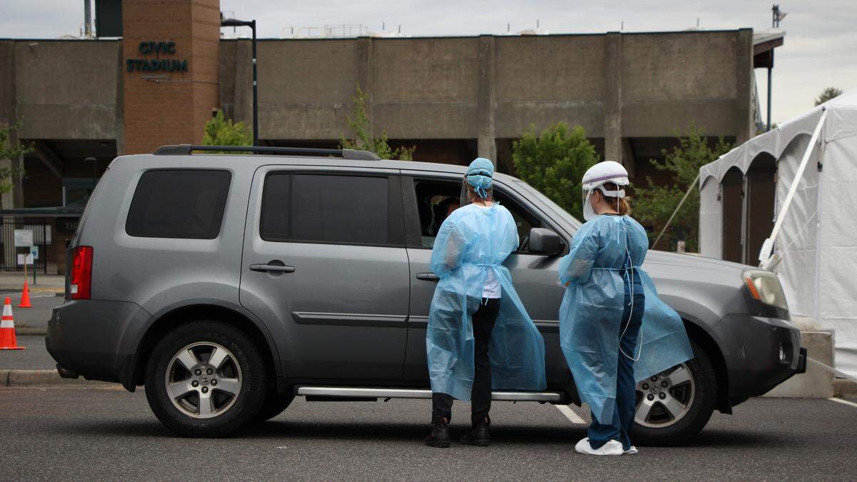 People in cars line up for COVID-19 testing by the Whatcom County Health Department Saturday morning, July 11, at Civic Athletic Complex in Bellingham.