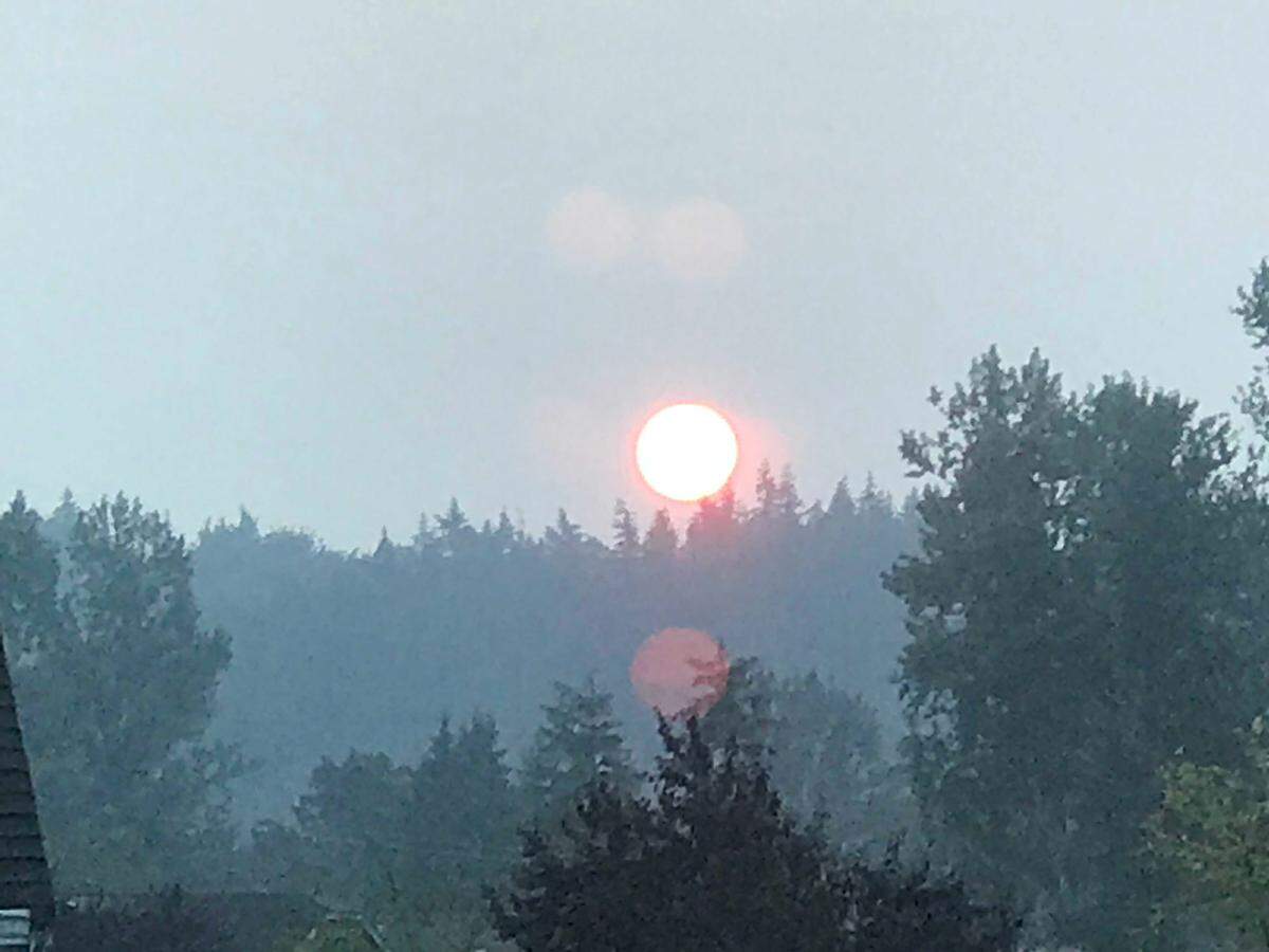 Thursday’s sunrise was still obscured by a smoky haze caused by wildfire smoke in the area.