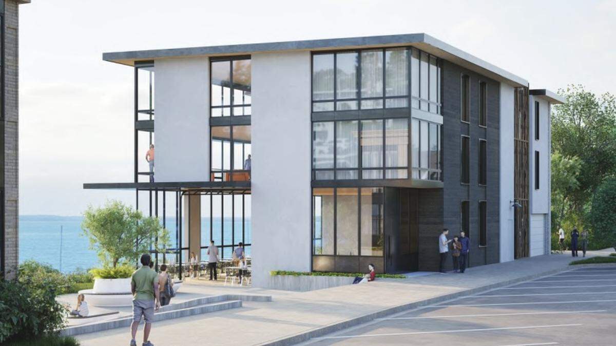 A 2024 rendering shows the mixed-use residential and commercial building proposed as part of a two-building development along 10th Street near Taylor Dock in Bellingham.