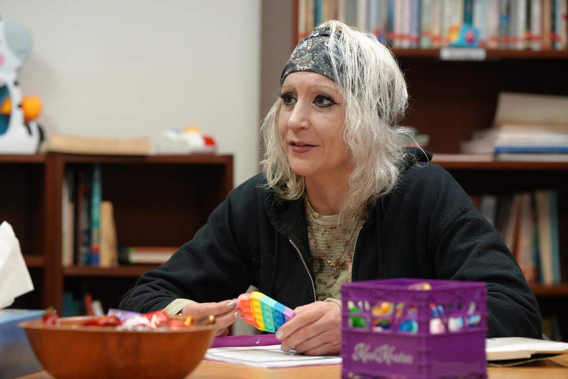 Amy Kenna speaks with a peer-support team member in the Recovery Circle room at the Recovery Café on Jan. 22.