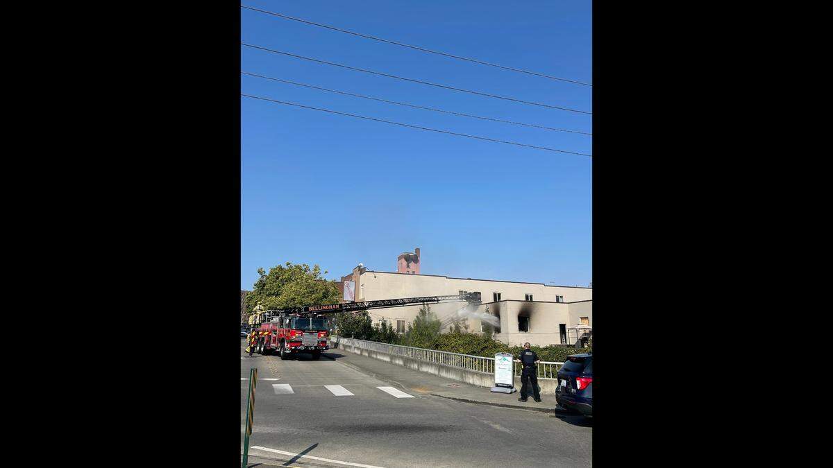 Bellingham fire crews work to put out a commercial fire just before 5 p.m. on Monday, Aug. 7, in downtown Bellingham, Wash.
