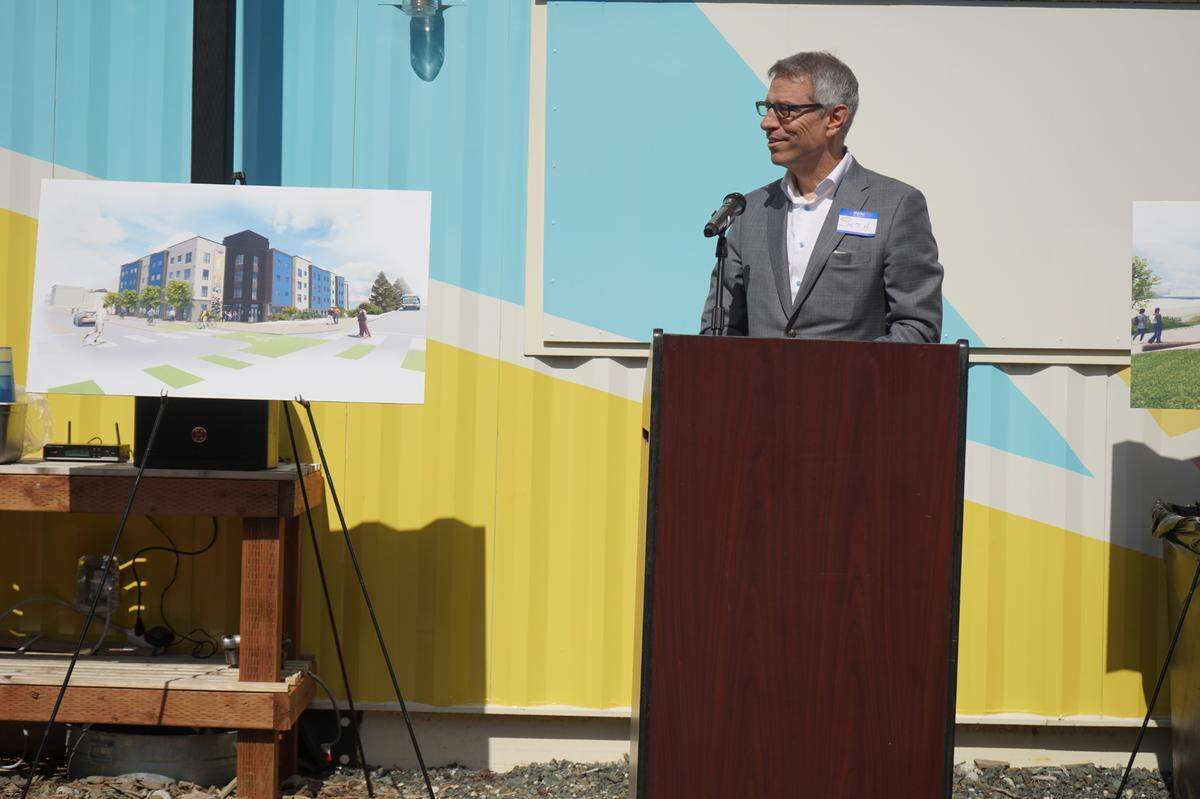 Mayor Seth Fleetwood speaks on Friday, April 14, at the groundbreaking ceremony for The Millworks Family Housing project in Bellingham. “When I was growing up in Bellingham, this was a mill. I don’t think, in my youth, it ever entered my mind that it would ever be anything but a mill,” Fleetwood said.