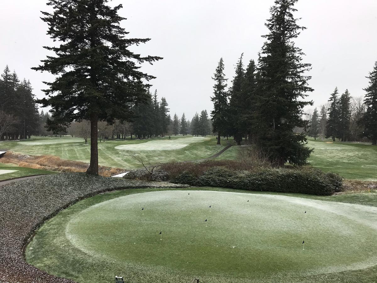 Snow falls on a putting green and the first and 10th fairways at Bellingham Golf and Country Club Sunday morning.