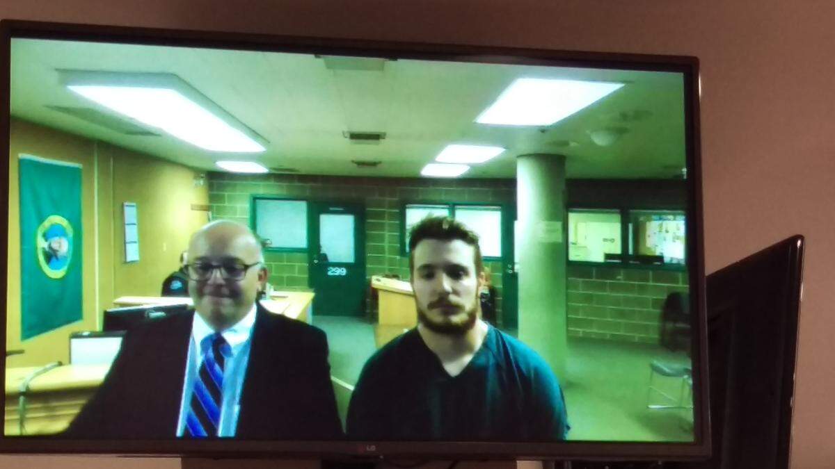 Ferndale resident Dalton Jacob Cristelli, right, makes his first appearance in Whatcom County Superior Court on May 31. He is accused of raping two underage girls and a female incapable of giving consent. Next to him is his attorney Bob Butler.