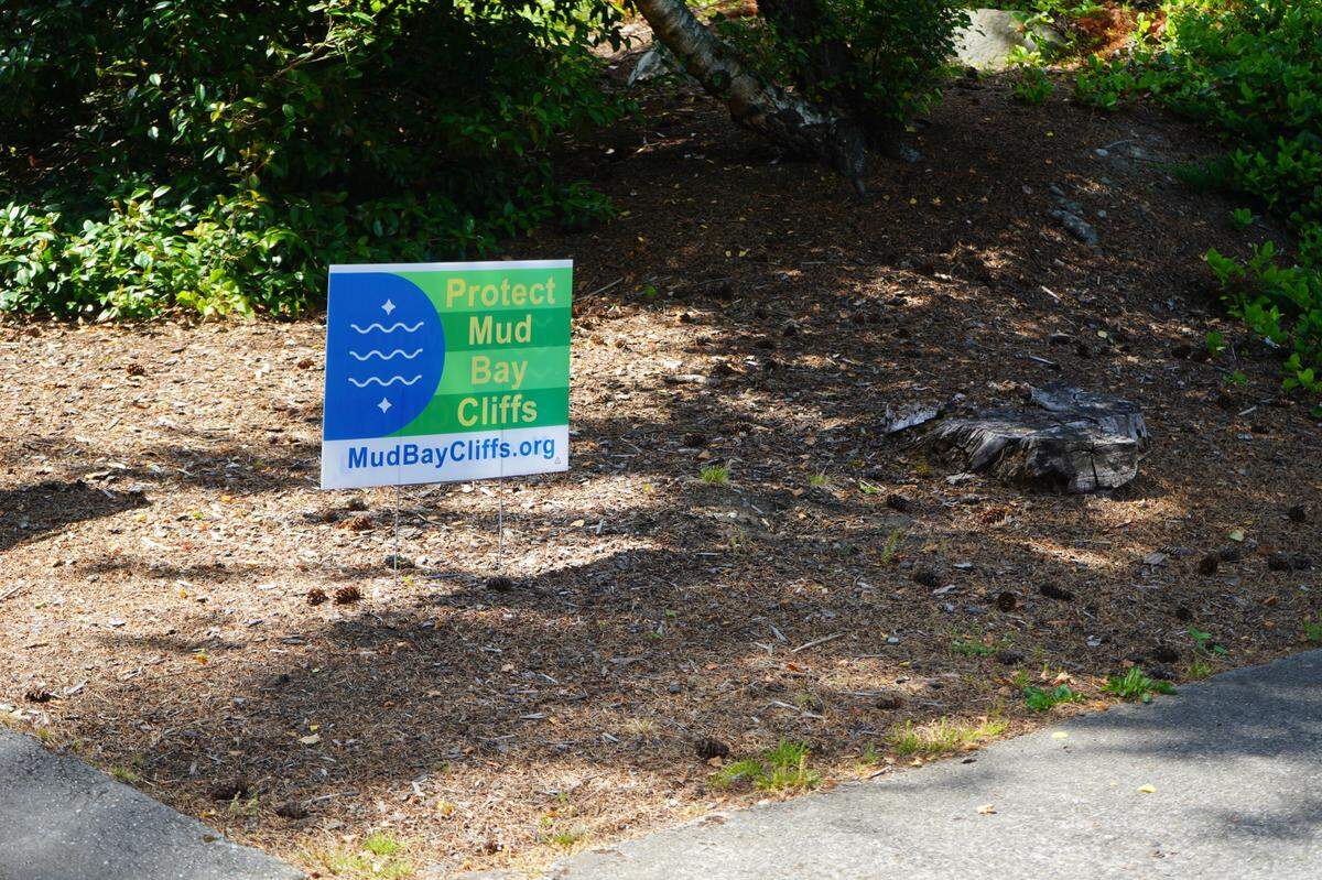 A ‘Protect Mud Bay Cliffs’ sign is posted in the front yard of an Edgemoor resident on July 6, 2023, in Bellingham, Wash.