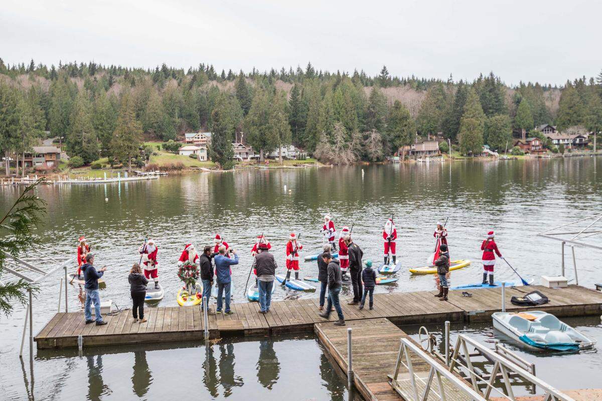 Lake Samish’s Santa Squad prepares for the second Christmas paddle on the lake south of Bellingham in mid-December.