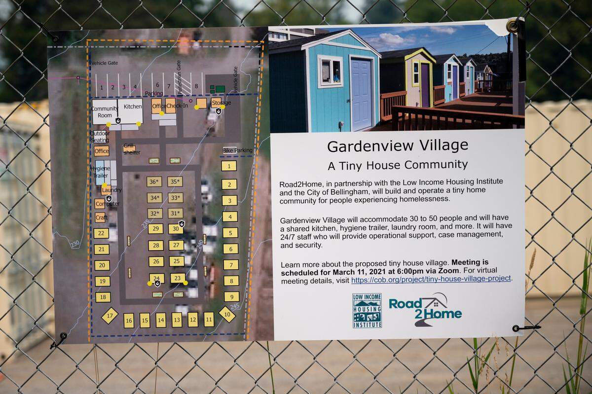 A sign offers details about the new Gardenview Village on the corner of Lakeway Avenue and Woburn Street on Friday, Aug. 13,in Bellingham.