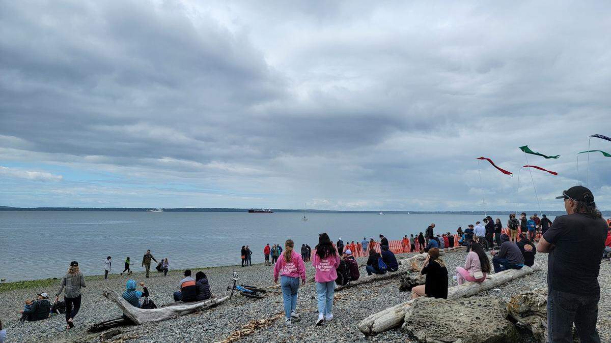 Banners fly in the breeze as people wait for the Ski to Sea finish at Marine Park in Fairhaven on Sunday, May 29.