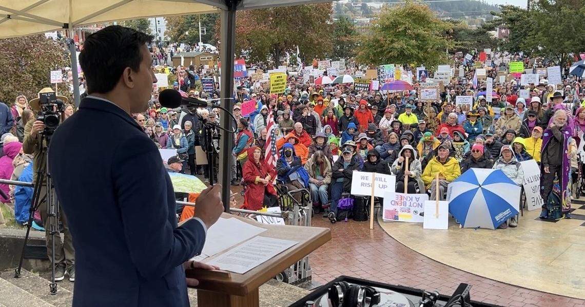 State Rep. Alex Ramel, D-Bellingham of the 40th District, addresses a crowd of thousands of people at the No Kings rally against the Trump administration in Maritime Heritage Park in Bellingham, Wash., on Saturday, Oct. 18, 2025.