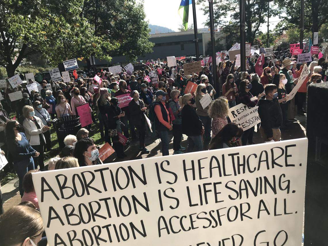 About 1,000 people gather at City Hall Saturday afternoon, Oct. 2, in Bellingham as part of the national Women’s March.