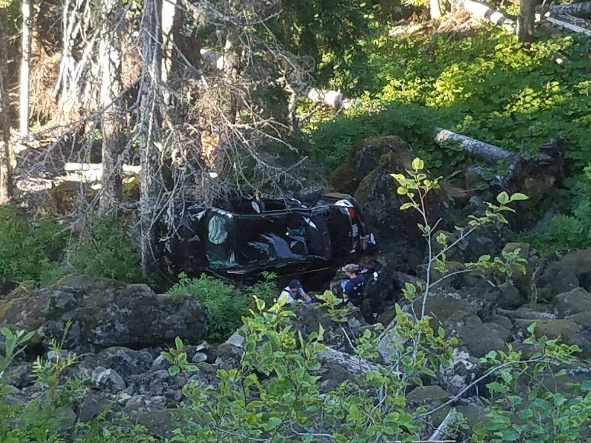 Whatcom County Fire crews from districts 19 and 14 rescue two occupants of a Honda Civic that left the Mount Baker Highway near milepost 51 and fell nearly 150 feet on Saturday. Neither occupant suffered any serious injuries.