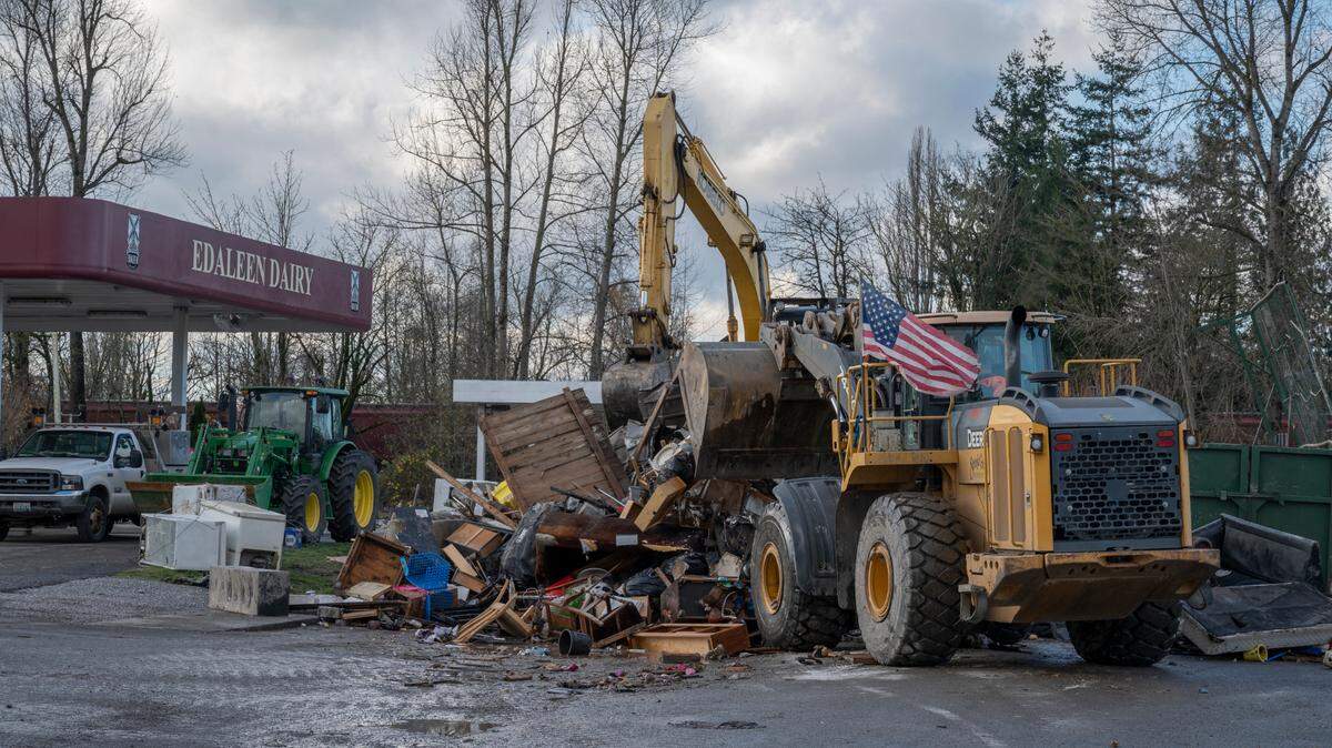 A pile of unsalvageable items damaged by recent floods waits for removal on Friday, Nov. 19, in Sumas.
