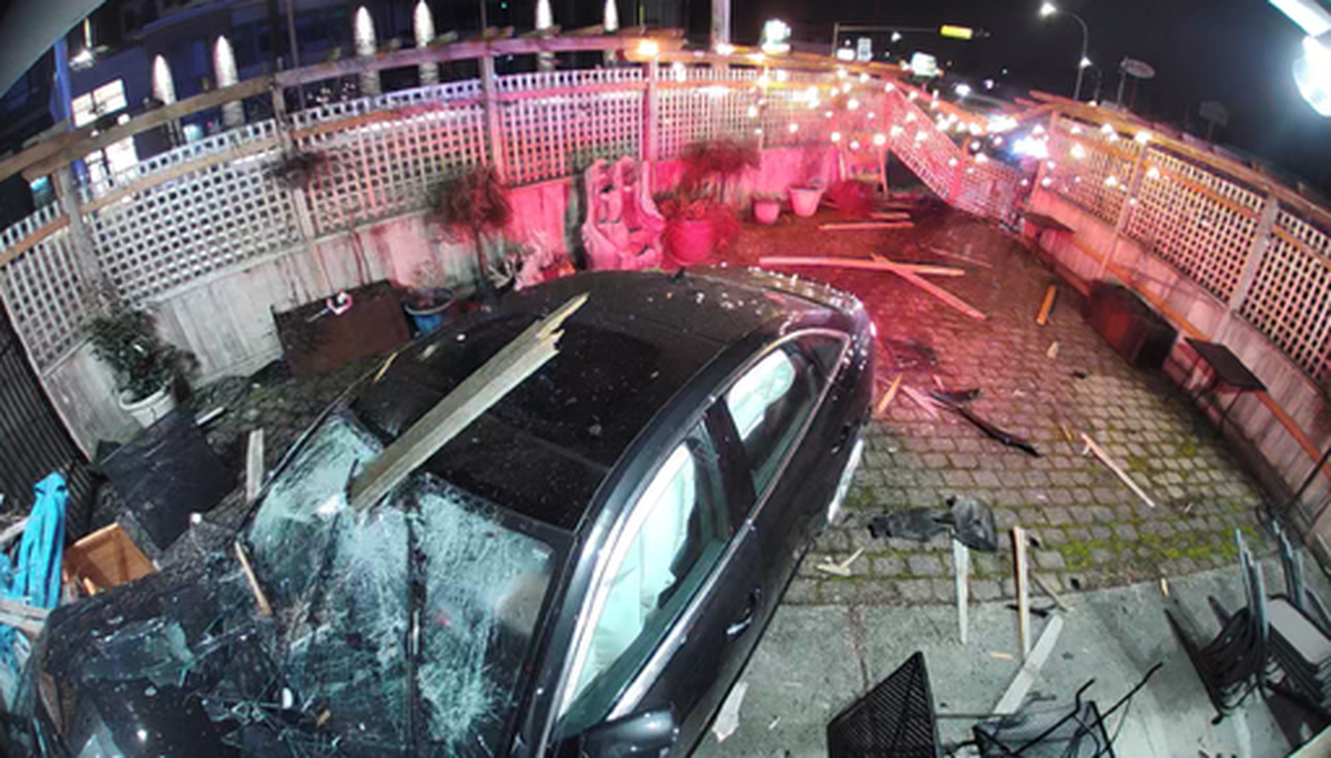 A vehicle drove through the fence and outdoor seating area of Slice of Heaven in Bellingham before crashing into the building on Monday, Feb. 19. 